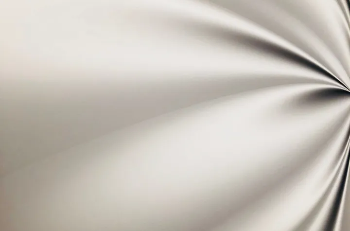 Beige satin texture; illustrative photograph, fiber composition unverified