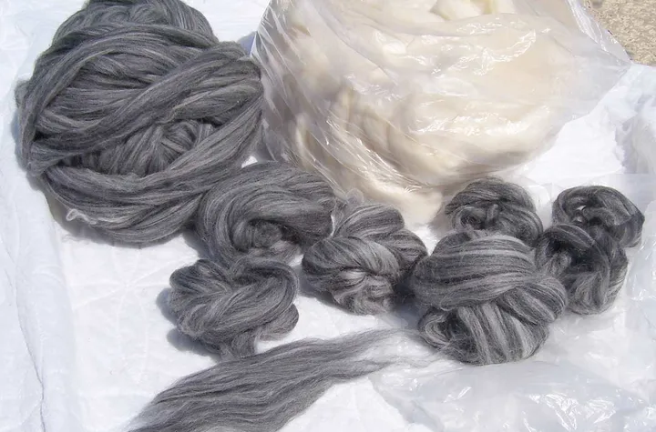 Grey wool roving before spinning